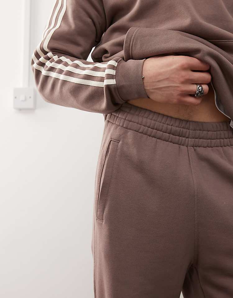 https://images.asos-media.com/products/adidas-originals-trefoil-essentials-joggers-in-brown/207194106-3?$n_750w$&wid=750&fit=constrain
