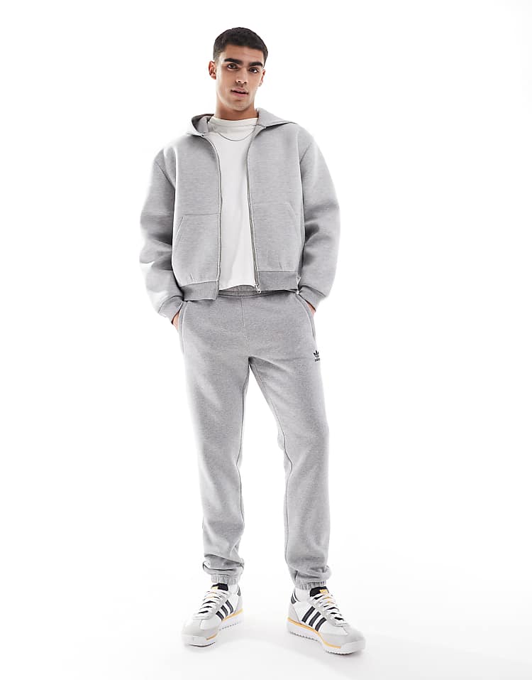 https://images.asos-media.com/products/adidas-originals-trefoil-essentials-joggers-in-grey/207194156-1-mediumgreyheather?$n_750w$&wid=750&fit=constrain