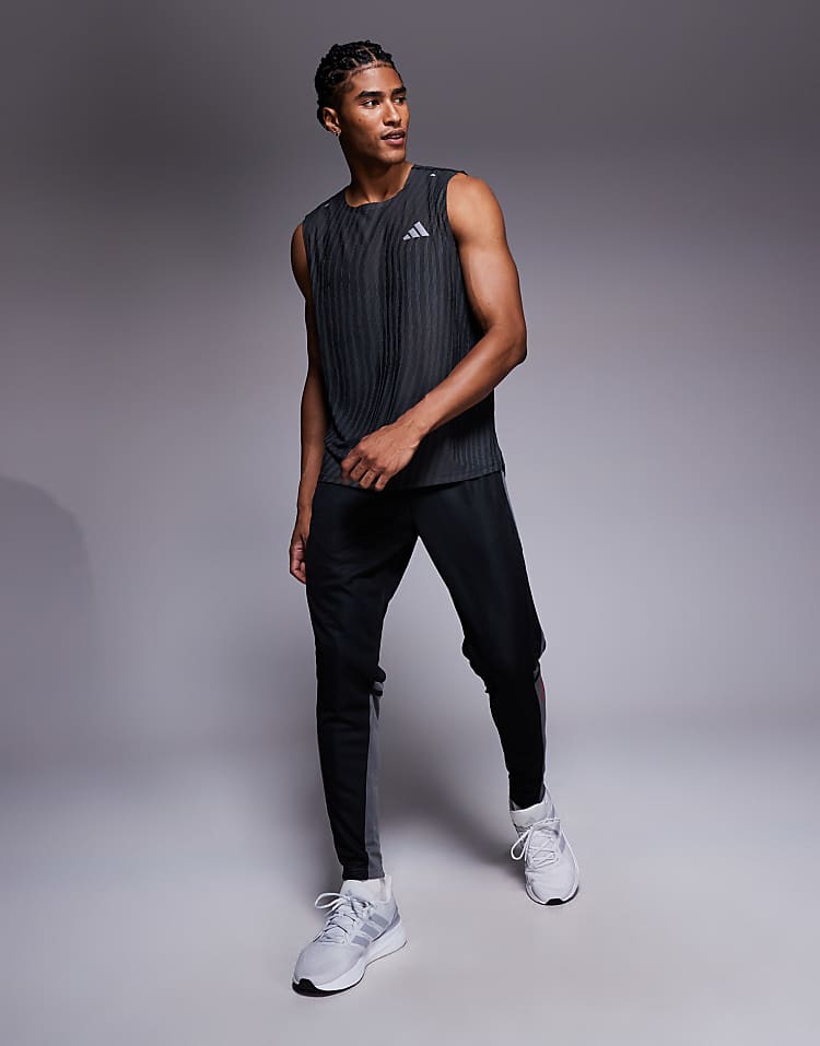 https://images.asos-media.com/products/adidas-football-squadra-joggers-in-black-and-red/208044942-1-blackteamgreyfour?$n_750w$&wid=750&fit=constrain