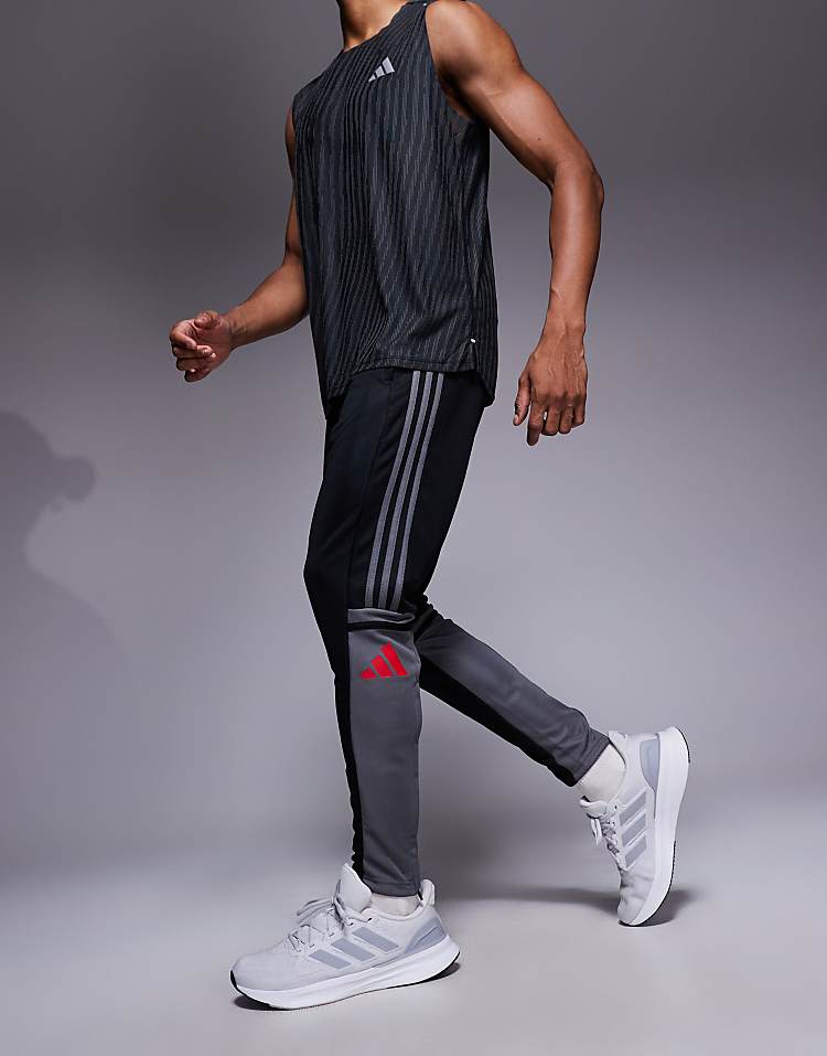 https://images.asos-media.com/products/adidas-football-squadra-joggers-in-black-and-red/208044942-2?$n_750w$&wid=750&fit=constrain
