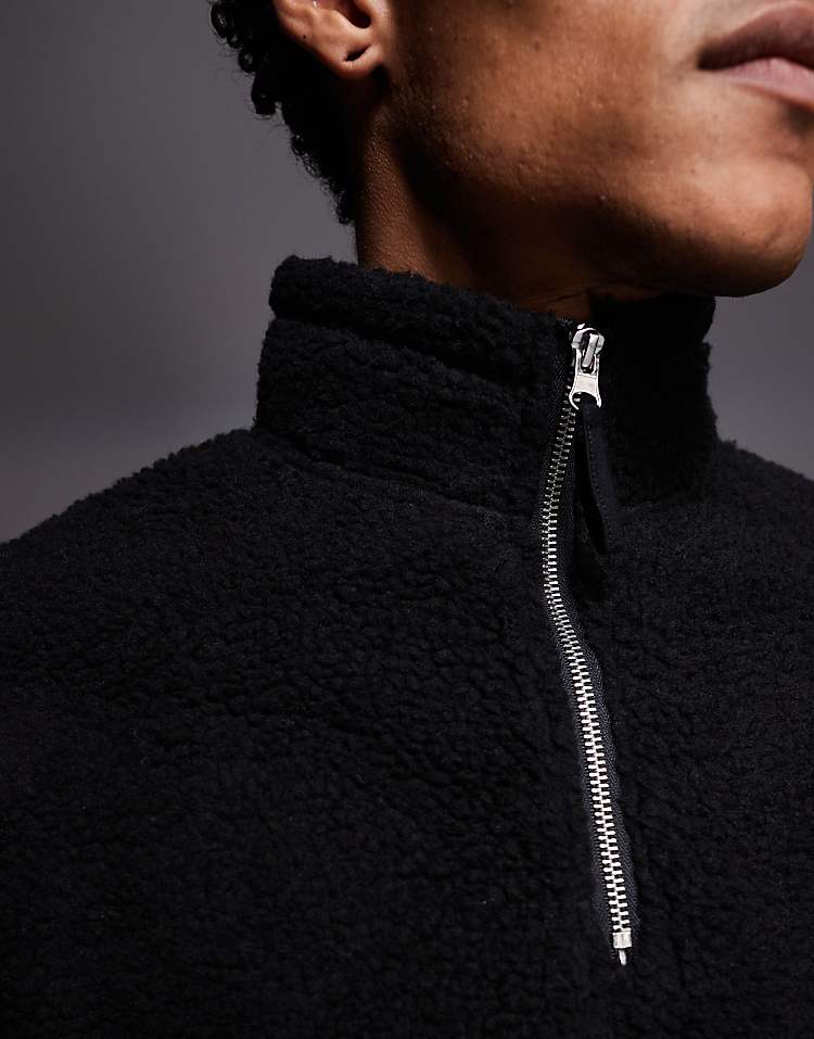 https://images.asos-media.com/products/asos-design-relaxed-funnel-neck-zip-through-borg-sweatshirt-with-piping-in-black/208549506-5?$n_750w$&wid=750&fit=constrain