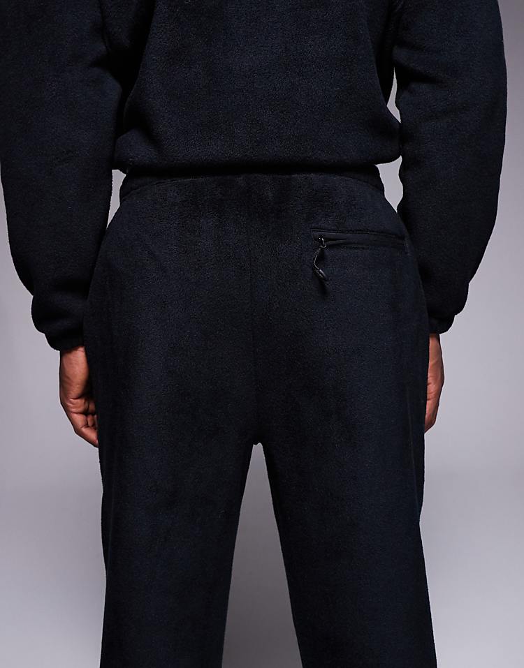 https://images.asos-media.com/products/asos-design-co-ord-tapered-fleece-jogger-in-black/208550145-4?$n_750w$&wid=750&fit=constrain