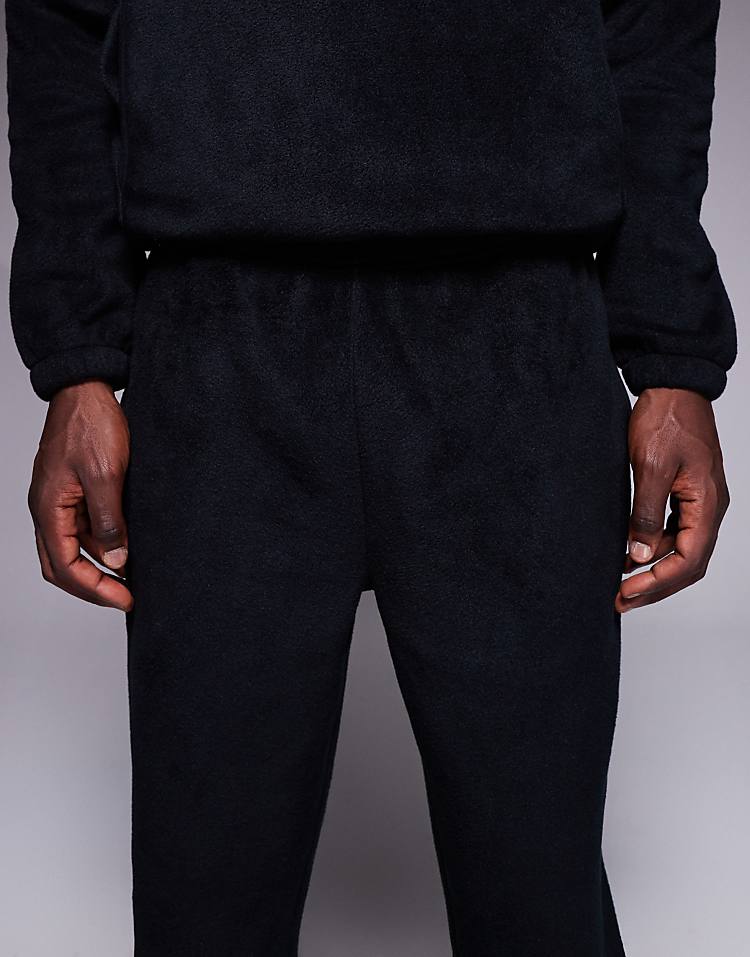 https://images.asos-media.com/products/asos-design-co-ord-tapered-fleece-jogger-in-black/208550145-5?$n_750w$&wid=750&fit=constrain