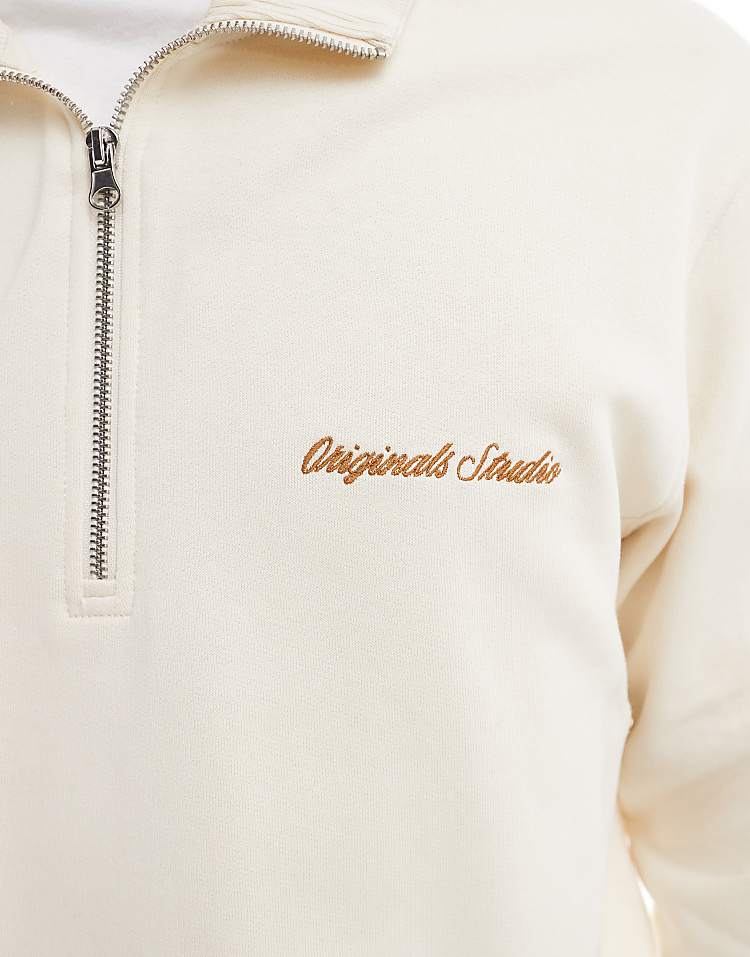 https://images.asos-media.com/products/jack-jones-relaxed-quarter-zip-sweatshirt-in-off-white/208948951-5?$n_750w$&wid=750&fit=constrain