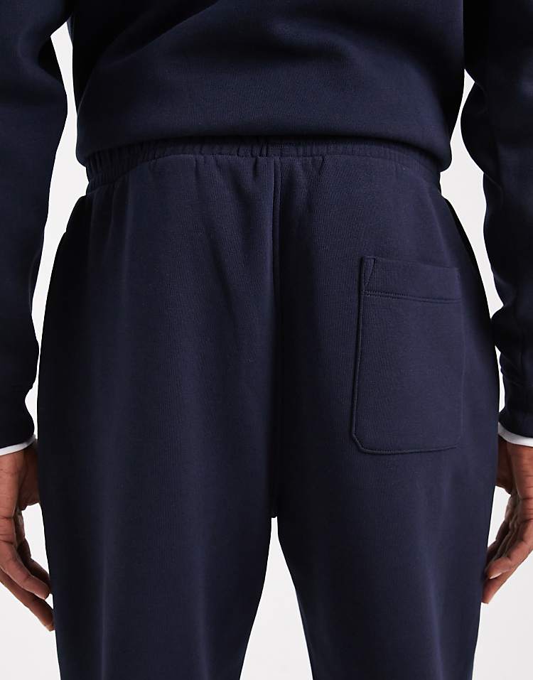 https://images.asos-media.com/products/asos-design-essentials-2-pack-tapered-jogger-in-black-and-navy/209310461-4?$n_750w$&wid=750&fit=constrain