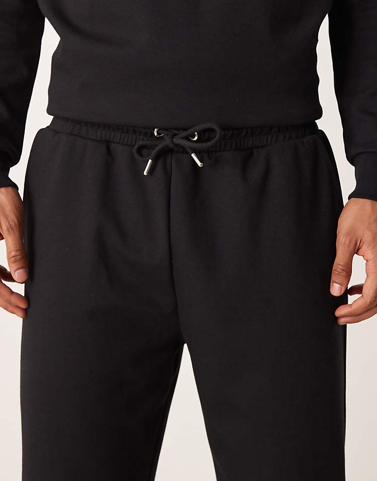 https://images.asos-media.com/products/asos-design-co-ord-breathemax-tapered-joggers-in-black/209331052-5?$n_750w$&wid=750&fit=constrain