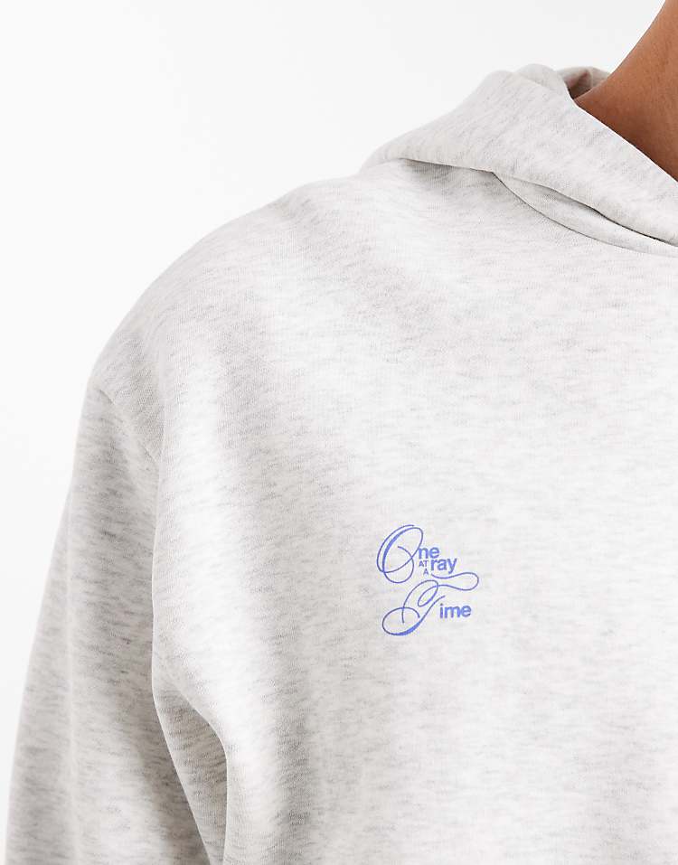 https://images.asos-media.com/products/asos-design-oversized-hoodie-with-text-print-in-white-marl/209390315-5?$n_750w$&wid=750&fit=constrain