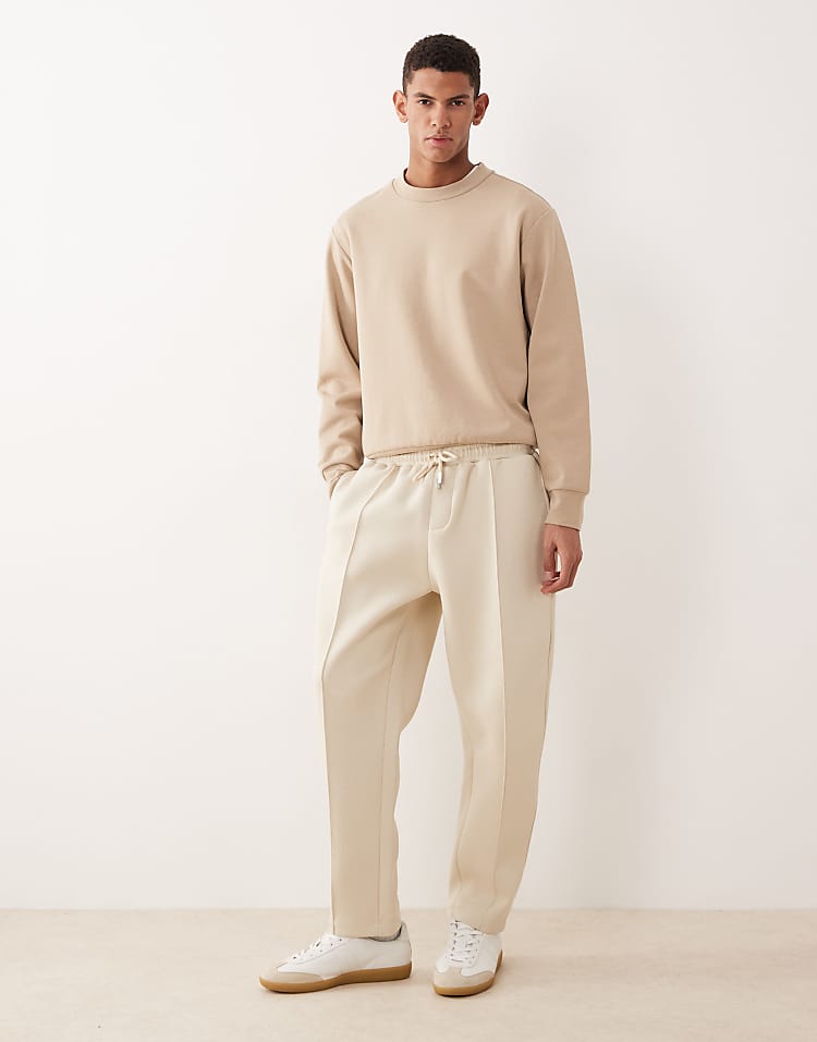 https://images.asos-media.com/products/asos-design-tapered-fit-jogger-in-scuba-style-fabric-in-biege-stone/209524583-1-peyote?$n_750w$&wid=750&fit=constrain