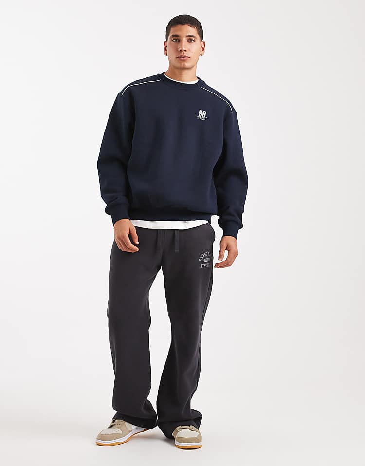 https://images.asos-media.com/products/asos-design-relaxed-fit-sweatshirt-with-piping-and-sports-number-graphic-in-navy/209669250-2?$n_750w$&wid=750&fit=constrain